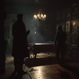 two men standing inside a dark building