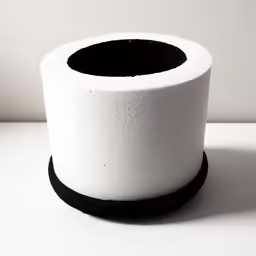 a white and black circular object sitting on top of a table