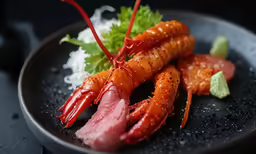 a black plate topped with different kinds of food