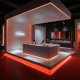 a white counter sitting under a neon lit sign