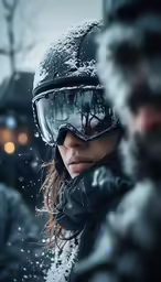 a woman wearing goggles standing next to a man