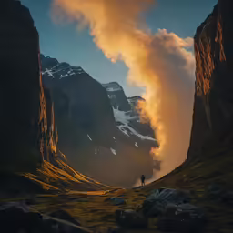 a mountain range has a tall cloud hanging over a mountain