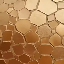 a tile covered wall with geometric shapes in yellow and brown