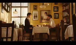 a man sitting at a table with a woman