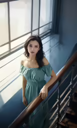 a beautiful young lady standing on top of a stair way