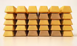 a pile of gold - colored squares are seen stacked in this photo