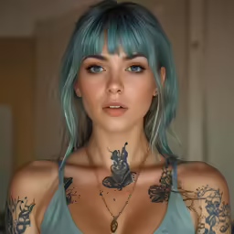 a beautiful young lady with blue hair and tattoos