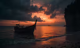 a fishing boat out in the water during sunset