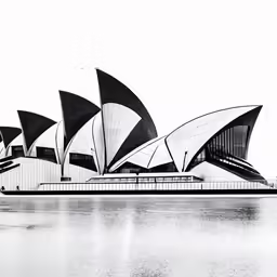 black and white photograph of a building with sails