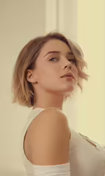a close up of a person wearing a tank top