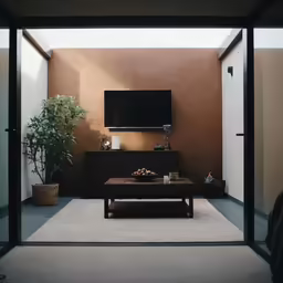 a living room with brown walls and a tv