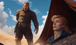 a woman and man standing on top of a desert