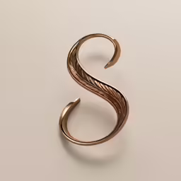 the bronze swirl ring has been placed on top of a plain surface