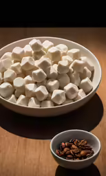 marshmallows are arranged in small dishes and on the table