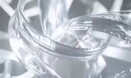 a stack of thin silver wires in a room
