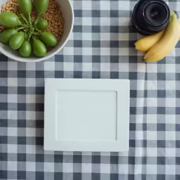 two fruit is laying next to the bowl and plate