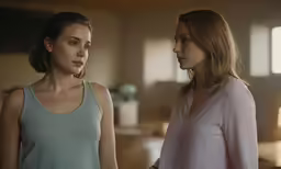 the woman is talking to the other woman