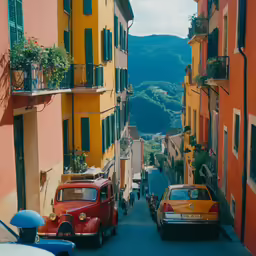 cars parked on the side of a street next to a tall building