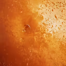 an abstract photo of yellow and brown dust and bubbles