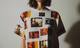 a woman is standing with her back to the camera, wearing a t - shirt with many pictures on it