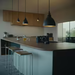 a kitchen has three lights on the ceiling