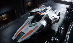 an extremely futuristic vehicle is parked inside a large building