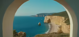 a view of the coast from an arch