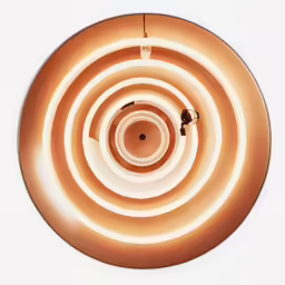 a spiral light is illuminated in an intricate design
