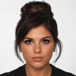 an attractive woman with a messy updo and black shirt
