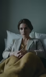 the woman is in a hotel room posing for a photo