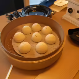 seven hard boiled eggs arranged on top of each other