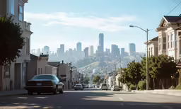 a street scene with cars, cars driving on the road and buildings in the background