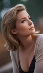 woman with blond hair wearing black shirt posing for picture