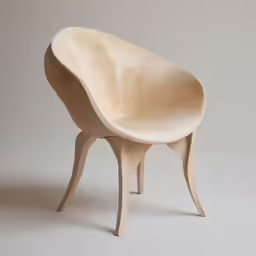 a chair made from wood sitting against a gray background
