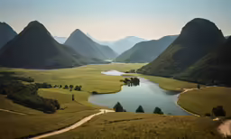 a lake surrounded by a lush green hillside