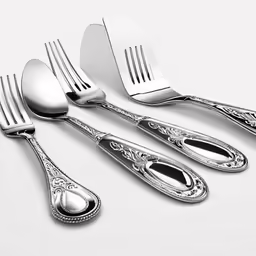 a group of forks and spoons next to each other