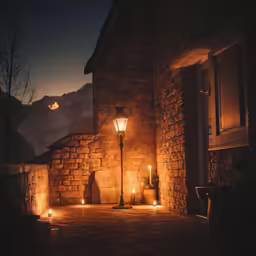outdoor lighting illuminates a building with windows