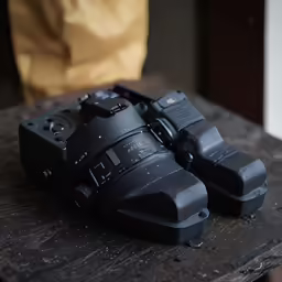 camera sitting on top of a table with no flash