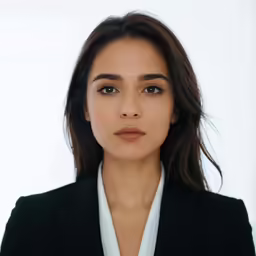 the woman is wearing a black jacket and white shirt