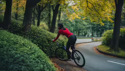 a woman in a red shirt riding a bike
