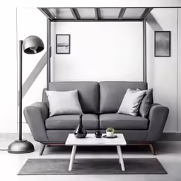 a white and gray couch and a table in a room