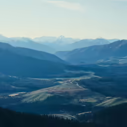 the mountains are beautiful with snow and low light