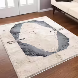 a rug that has been decorated with black and white designs