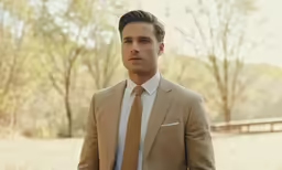 there is a man wearing a suit and tie