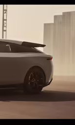 a sleek gray sports car with sunroof sits in an empty parking lot