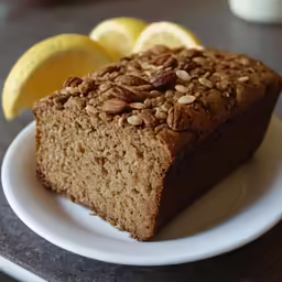 a piece of brown cake and some lemons