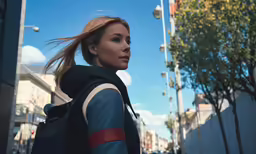 a young woman is in the middle of a city street
