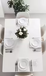 a long dining table that is set for four