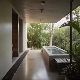 a modern house with an outside hot tub