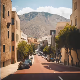 an empty city street with buildings and parked cars